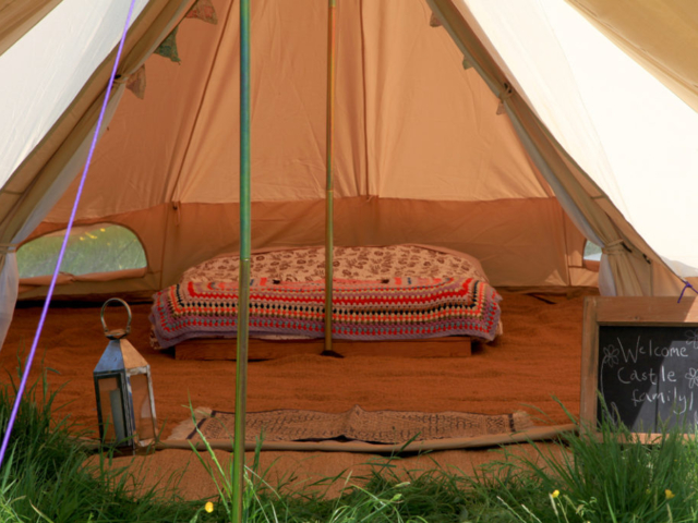 Bell tents at Pete's Field campsite have carpets and beds