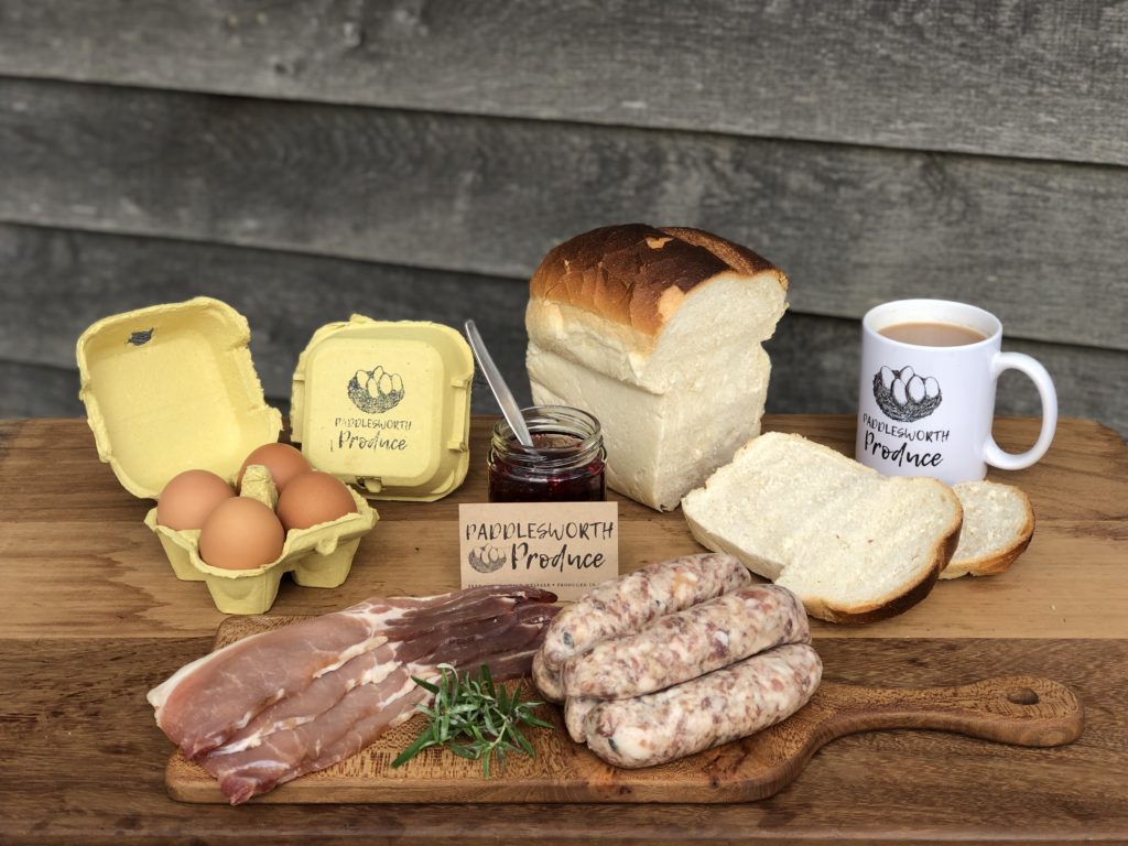 Campsite cooking ideas don't come better than the PAddlesworth Breakfast Box pictured featuring eggs, bacon, sausages, bread and jam